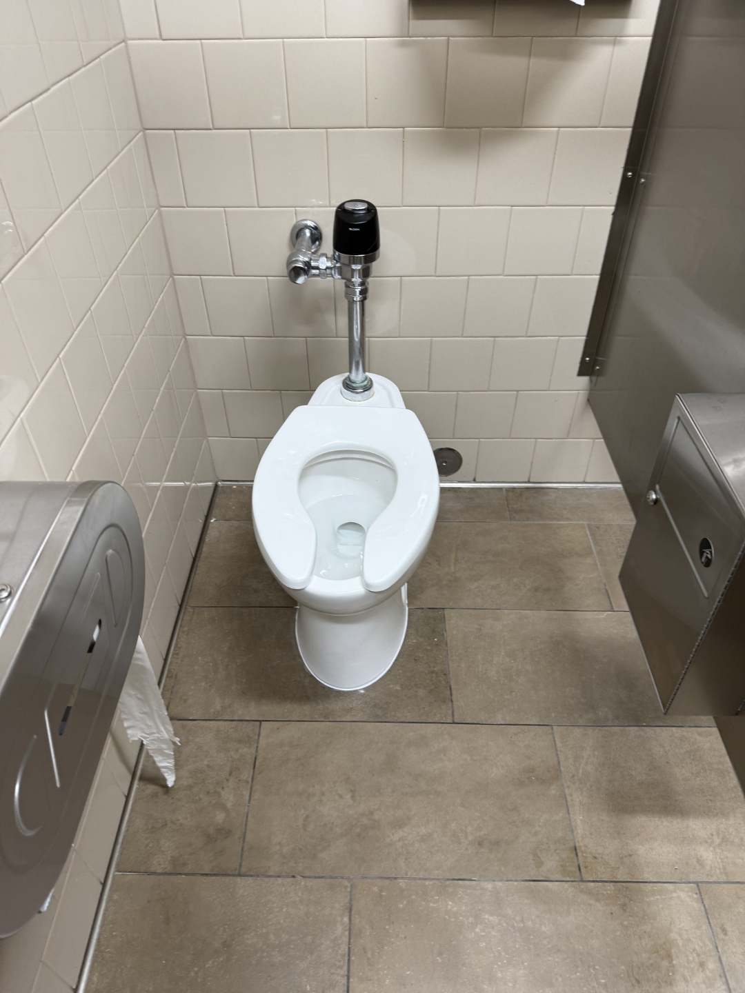 Commercial flush valve toilet installed by Haltex Plumbing