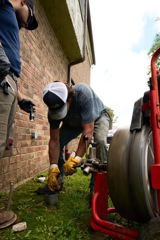 Haltex crew using a professional drain machine on an exterior sewer line